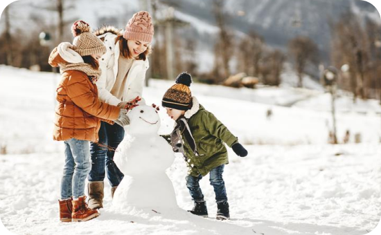 Image of a family building a snowman